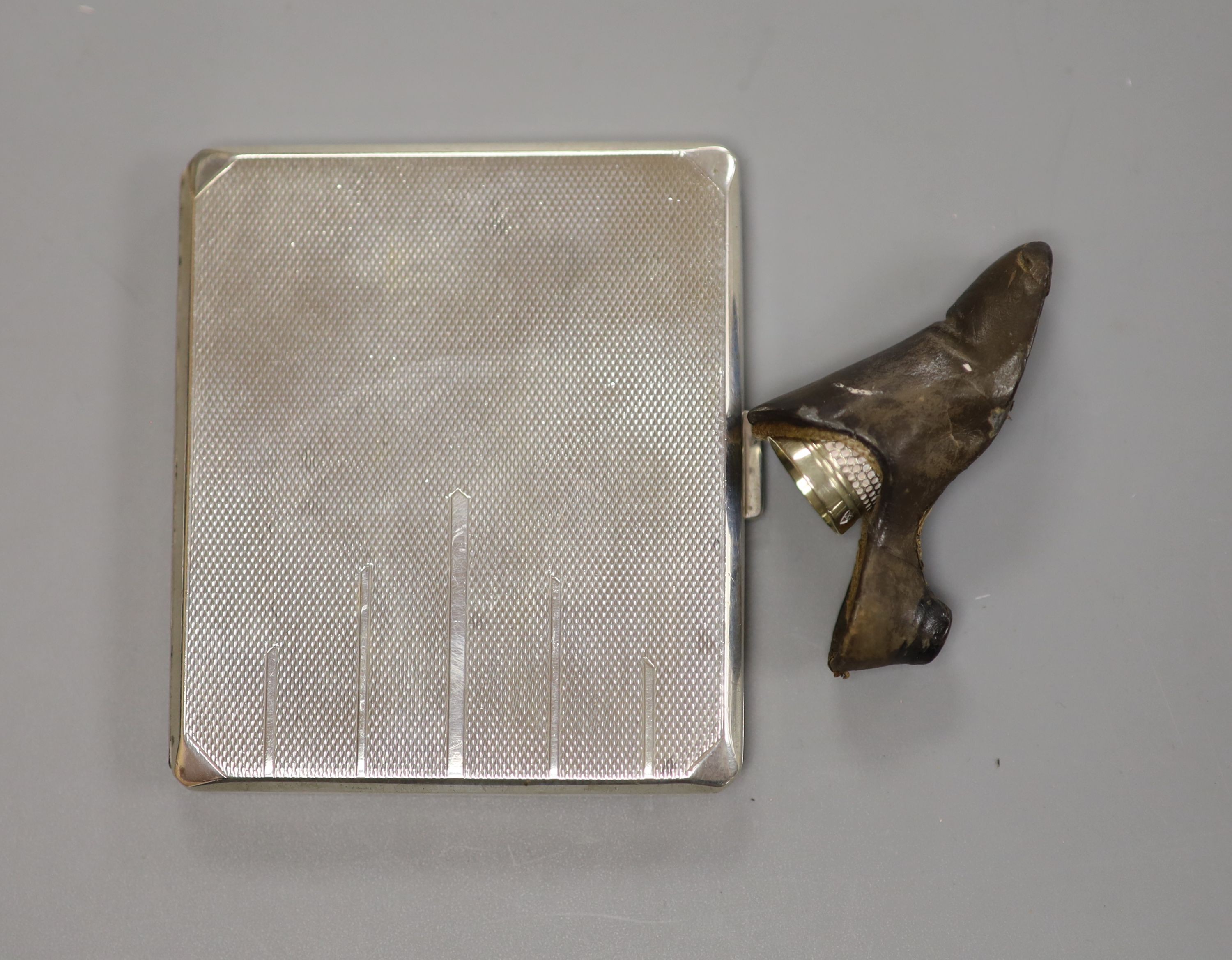 A silver cigarette case, Georgian silver caddy spoon, London, 1817, a pair of silver salts, etc.